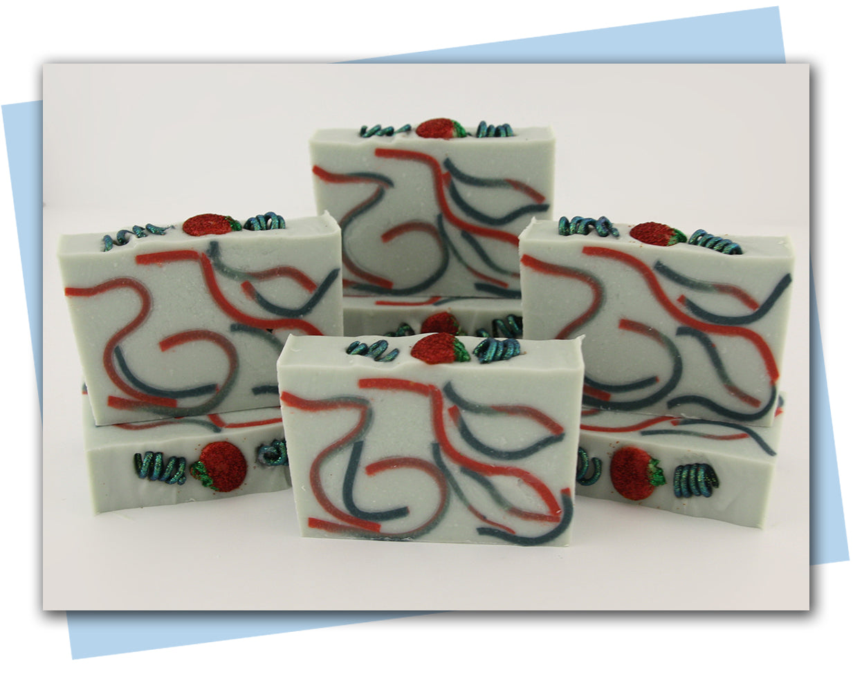 red and green swirls with a tomato and vine top embellishment bars of soap