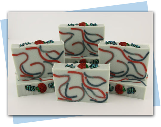 red and green swirls with a tomato and vine top embellishment bars of soap