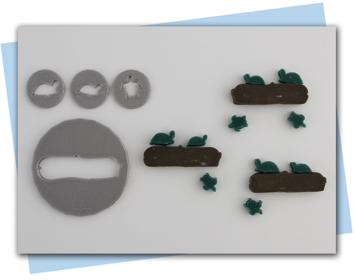 turtles sitting on a log and one swimming extruder idsc set