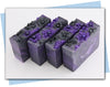 black and purple flowers with a purple to black ombre swirl design bars of soap