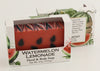 Bars of soap in custom packaging made to look like a watermelon with green bottom layer and black seeds in the pink layer