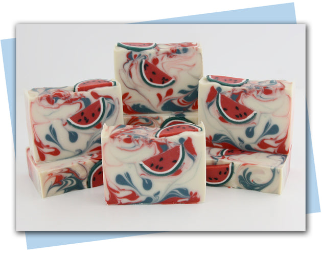 white base soap with red and green swirls and watermelon slice soap embeds