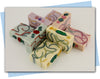 red and green swirls with a tomato and vine top embellishment bars of soap