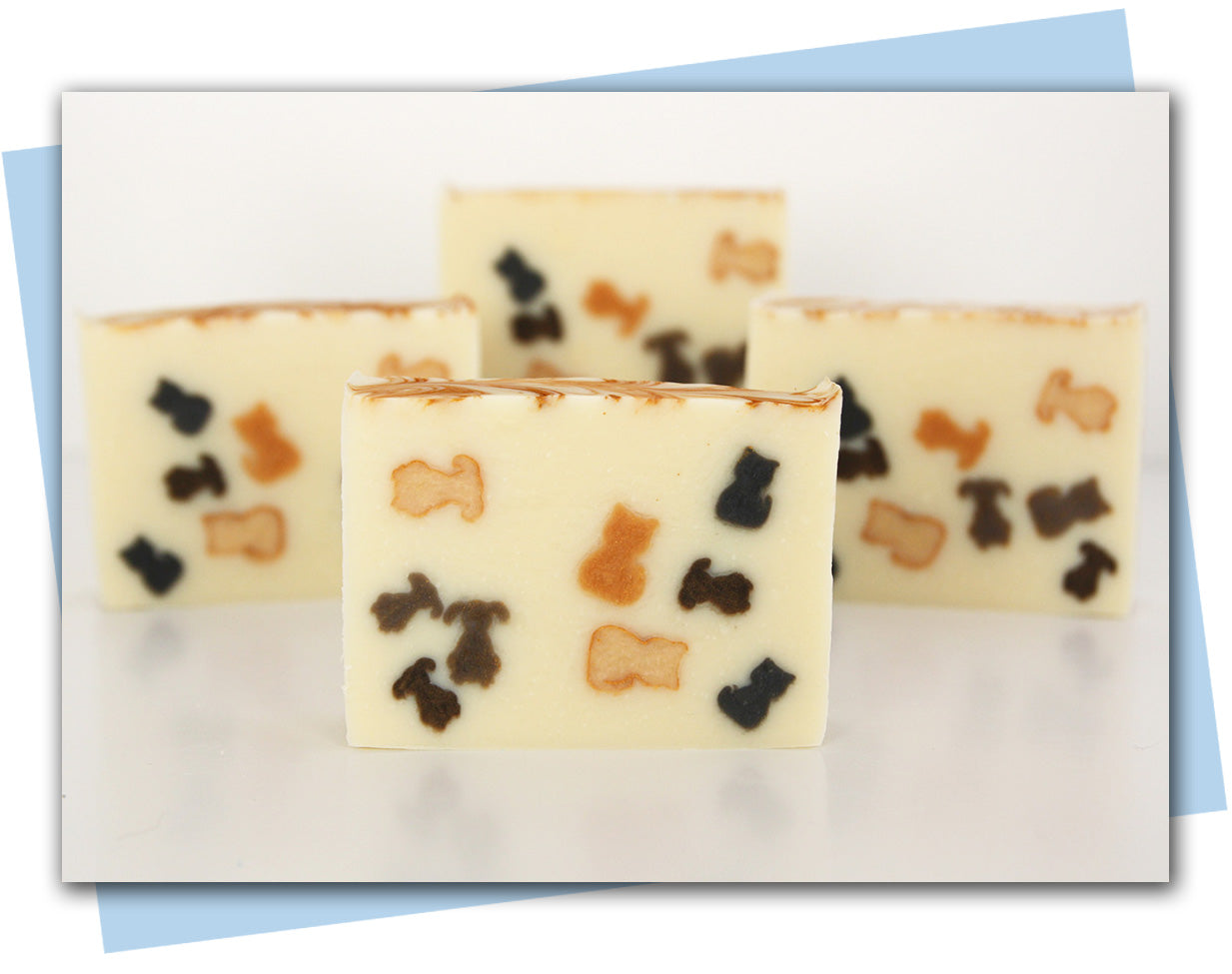 bar soap with cat and dogs embedded in design