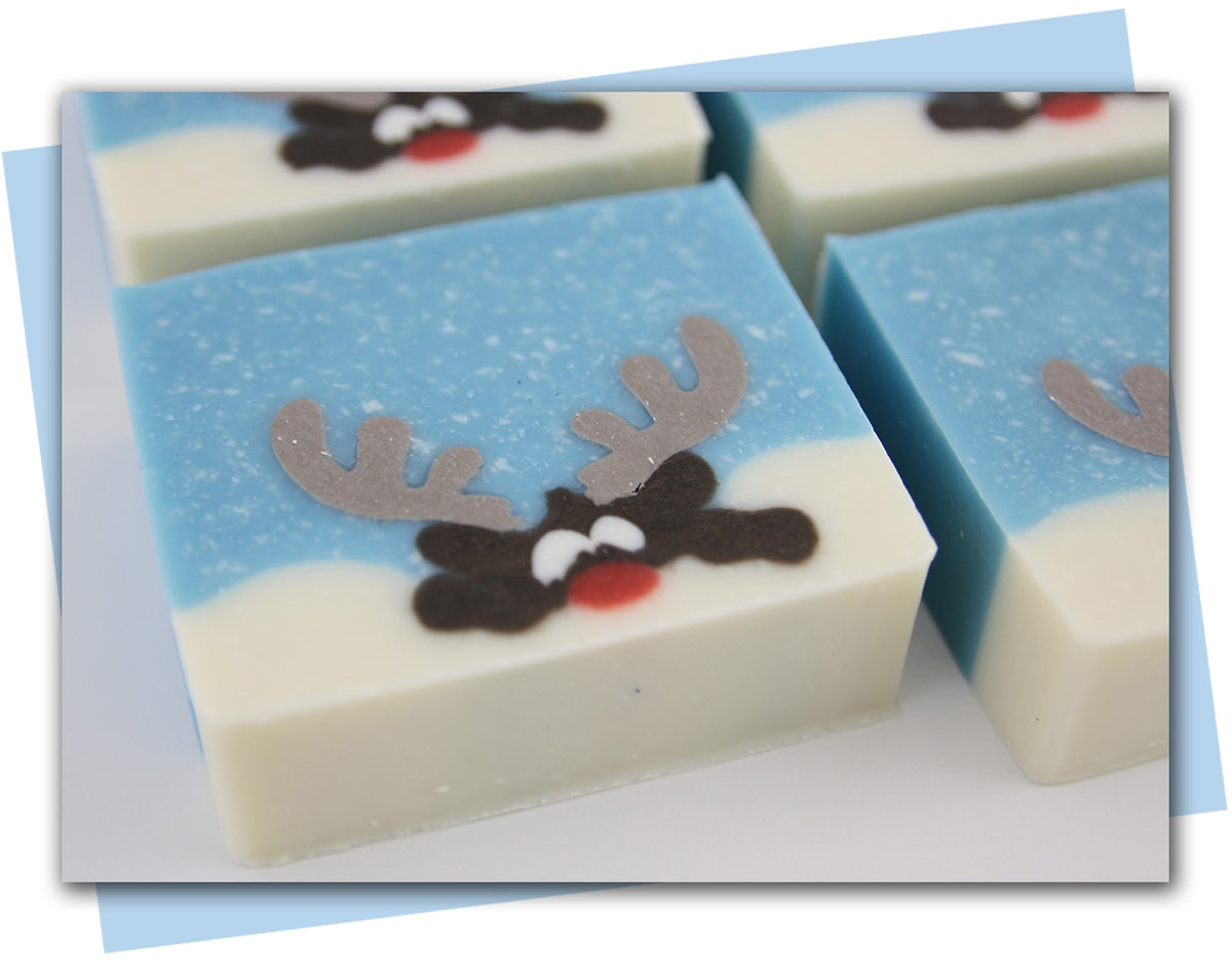 reindeer looking over mound of snow soap