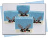 reindeer looking over mound of snow soap